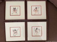 All four framed LE prints from Lee NGO shown together on floor