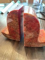 Close-up photo of two alabaster bookends showing their color and texture.