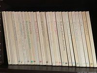 Photo shows the entire set of 27 Time Life “Foods of the World” hardcover cookbooks arranged vertically, spines visible with titles