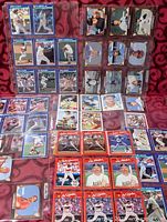 Binder pages showing blue-border 1991 Score cards and red-border cards