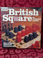 Front of British Square board game box showing title, brand and image of game setup