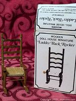 Chair next to box front showing graphic and text