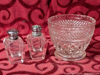 Full view showing pressed glass cup and two salt and pepper shakers
