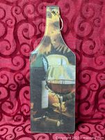 Full view of glass board front showing wine image and handle