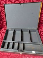 cash box open showing interior compartments