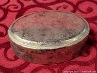 Top view of oval silver-plated jewelry box