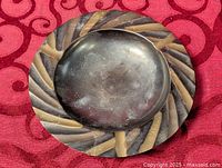 Top view showing full ashtray, swirl pattern rim