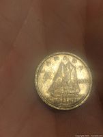 Obverse side of the 1940 Canadian silver 10 cent coin showing the Bluenose schooner and the date '1940'.