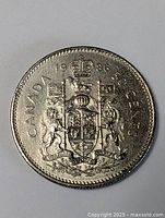 Full view of the 1986 Canadian 50 cent coin showing date, denomination, and coat of arms.