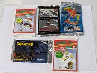 Lot of five sealed vintage hockey card packs including Score 1991 series, 1995-96 Super Slicker, 1994-95 collector's cards, and SkyBox Gargoyles pack.