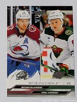 Front side of the dual hockey card showing Nathan MacKinnon and Kirill Kaprizov in game poses with team logos and player positions.