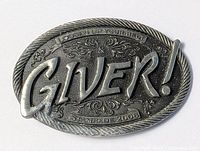 Front view of the oval pewter belt buckle showing 'GIVER!' text and decorative engraved details.