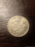 Reverse side of the coin showing denomination 5 cents, date 1903, crown and wreath design.