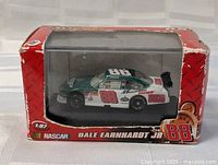 Sealed diecast car in original box with Dale Earnhardt Jr. #88 graphics visible through clear plastic.