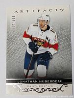 Front view of Jonathan Huberdeau hockey card with serial number 059/110 in mint condition.