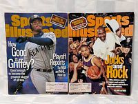 Pair of Sports Illustrated magazines side by side, showing front covers featuring Ken Griffey Jr. and a group of athletes/rock artists.