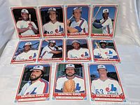 Photo showing 11 vintage Montreal Expos baseball player photo cards, each about 6 inches, assorted player poses