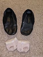 Top view of Capezio jazz shoes and beige toe pads