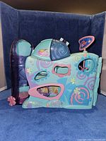 Front view of blue Littlest Pet Shop house showing elevator tower and graphics