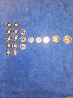 All coins laid out on blue background