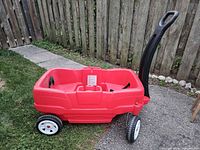 Full view of red Step2 wagon showing handle, wheels and body