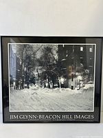 Front view of Jim Glynn beacon hill snow street scene framed poster with signature visible.