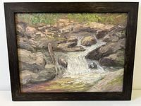 Full view of the framed oil painting depicting the waterfall scene