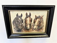 Front view of framed watercolour painting showing three work horses side by side, signed E M Alderson at bottom right.
