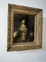 Frontal view of the framed 19th century portrait painting with visible details of the man's face, attire, and the carved wooden frame.