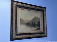 Front view of antique framed Dutch landscape painting showcasing the entire artwork and frame.