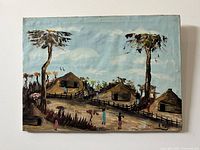 Full view of antique oil painting showing a rural village scene with houses, trees, and people, set under blue sky with clouds.