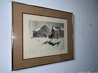 Front view of framed lithograph showing snowy rural scene with buildings and signature.