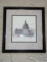 Front image of framed art print depicting St Paul’s Cathedral London with black frame and light matting.