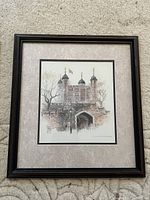 Front view of framed watercolor artwork depicting Tower of London, with black frame and gray matting.