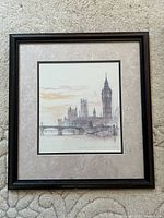 Framed print showing entire artwork and frame on carpeted floor.