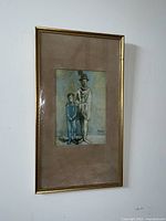 Framed artwork hung on wall, image shows whole piece including frame and matting.