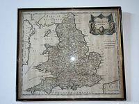 Front view of framed hand-coloured vintage map of England by Robert Morden, showing full map and decorative cartouche