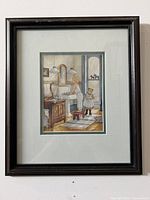 Framed print showing woman and child in domestic setting near washbasin