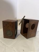 Side view of the vintage wooden Kodak camera box showing lens and ventilation holes