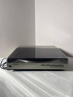 Front view, lid closed showing front-panel controls and Technics logo