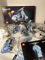 LEGO Vespa 125 box with 7 sealed bags of pieces and two instruction manuals
