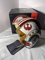 Front view of helmet with box and manual showing overall appearance