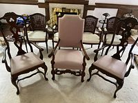 Three 1940s Queen Anne style arm chairs arranged together showing the front view. Two side chairs and one arm chair.