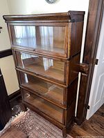 Front view of full four-unit bookcase on base