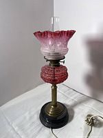 Full lamp front view showing base, column, font, shade and cord