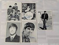 All five Beatles trading cards laid out
