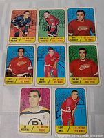 All eight 1967-68 Topps hockey cards laid out