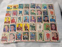Overview of roughly 36 1969-70 O-Pee-Chee hockey cards laid out in grid