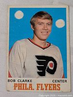 Front view of Bobby Clarke rookie card showing image, team name and position