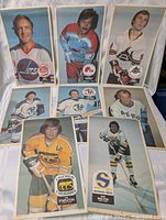 Seven posters laid out showing player images and team logos